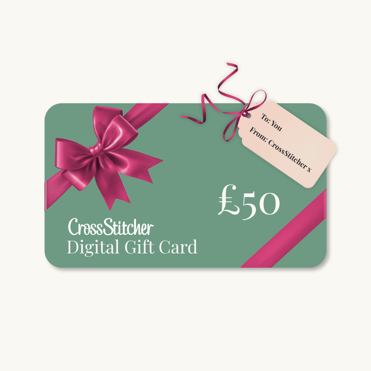 A £50 CrossStitcher digital gift card with a sage green background, a large magenta ribbon bow, and a small hanging tag that reads 'To You From CrossStitcher x'.